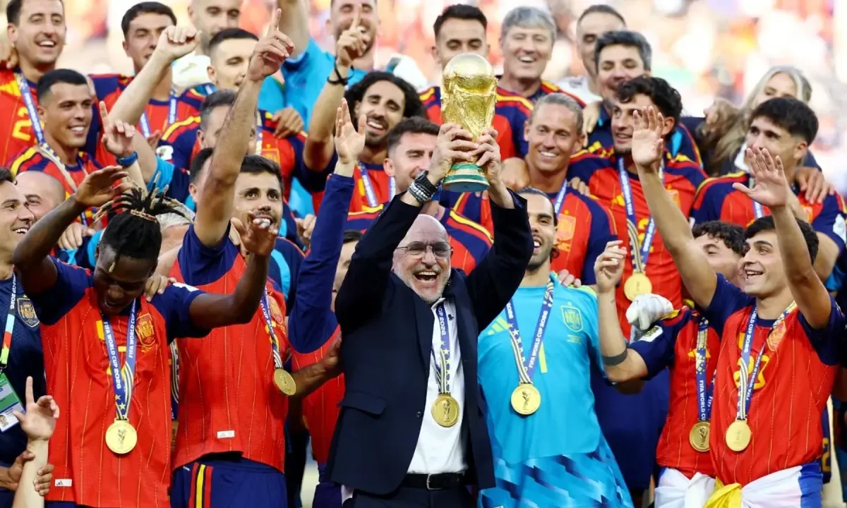 Spanish coach Luis de la Fuente lifts the FIFA World Cup trophy as the team celebrates their victory at the New York/New Jersey Stadium, East Rutherford, New Jersey, the US on July 19, 2026.