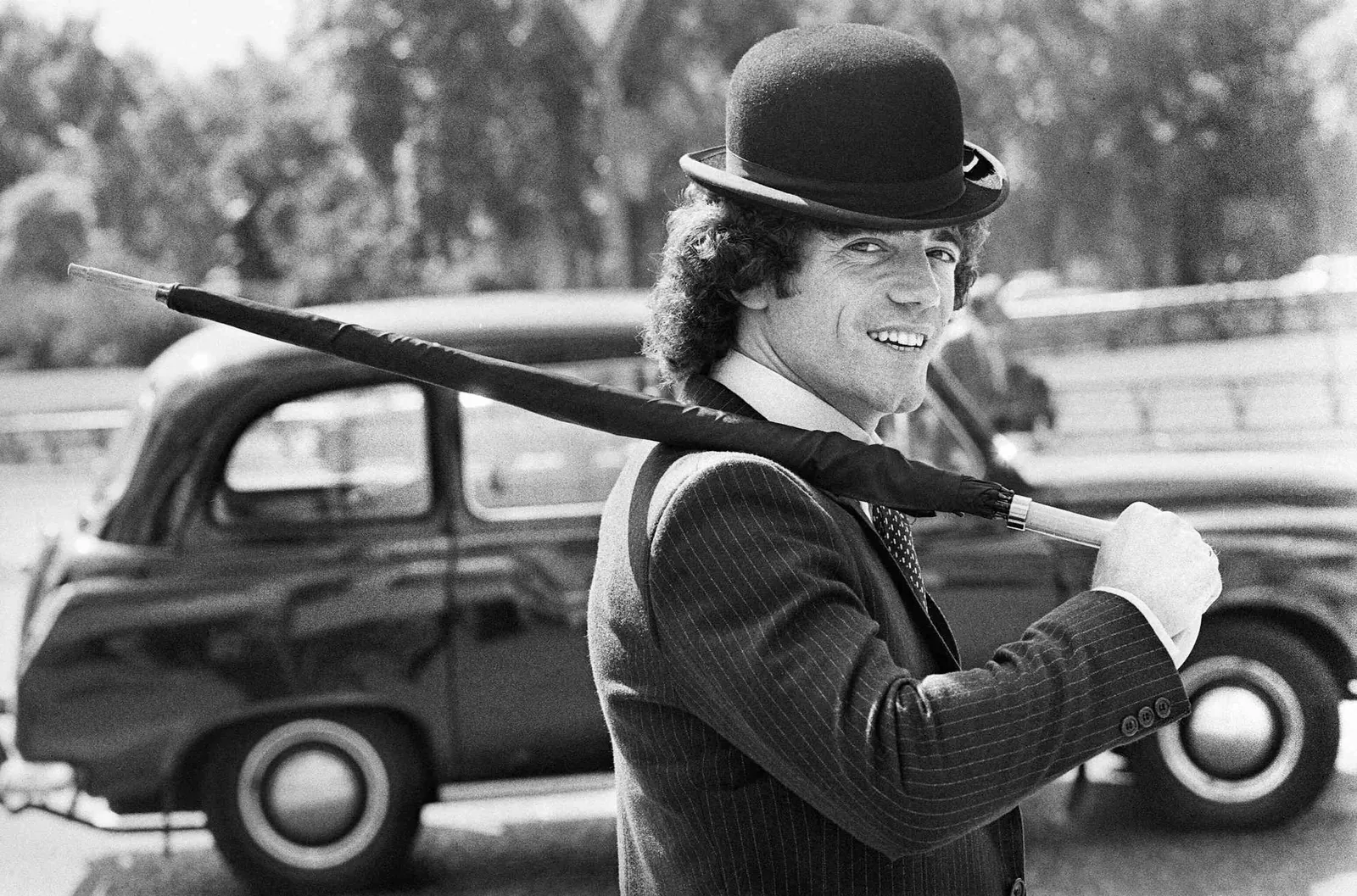 Keegan in a suit and bowler hat